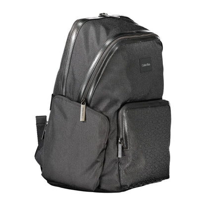 Backpack by Calvin Klein for men in polyester black & signature showcases a stately Polyester Backpack design, featuring a secure zipper with stately external-pockets, internal-pockets & laptop-compartment and versatile backpack-strap, adjustable-strap & handle.