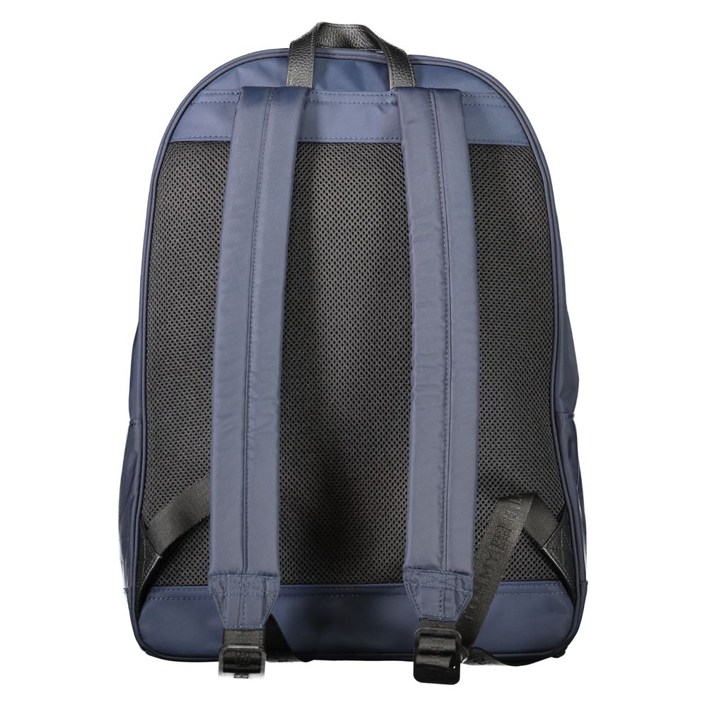 Backpack by Tommy Hilfiger for men in polyester blue showcases an architectural Polyester Backpack design, featuring a secure zipper, ample external-pockets, internal-pockets & laptop-compartment, and architectural handle, backpack-strap & adjustable-strap for a sophisticated look.