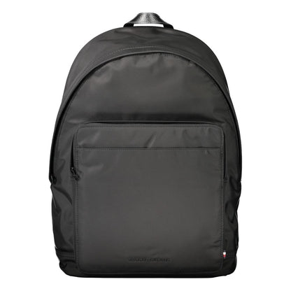 Backpack by Tommy Hilfiger for men in polyester black presents a stately Polyester Backpack design, showcasing a secure zipper with ample external-pockets, internal-pockets & laptop-compartment and versatile handle, backpack-strap & adjustable-strap for a stately finish.