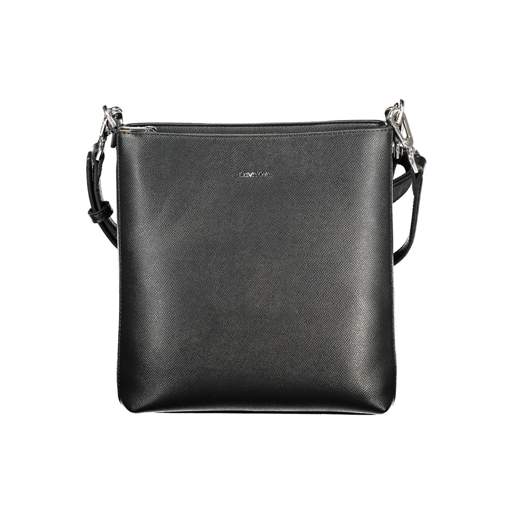 2-in-1 Shoulder & Crossbody Convertible Handbag by Calvin Klein for women in polyester black presents a enviable design with a secure zipper, ample internal-pockets, and versatile crossbody-strap, shoulder-strap, adjustable-strap & handle for a sophisticated look.