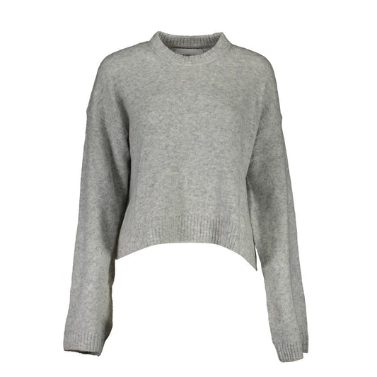 Sweater by Calvin Klein for women in wool gray showcases a sumptuous silhouette, artfully finished with a sumptuous round neckline and long-sleeve for a sophisticated, sumptuous look.