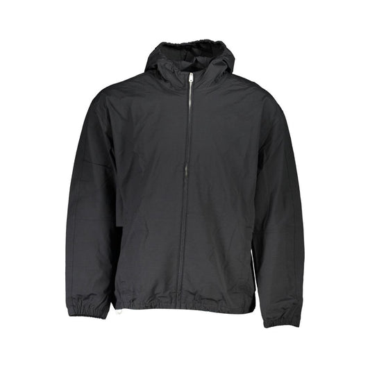 This Hooded Jacket by Calvin Klein for men in cotton black showcases a magnificent silhouette, meticulously crafted with a distinctive hooded neckline and functional water-resistant, pockets & hooded for a magnificent finish.