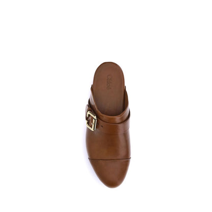 Platform Clogs Mules Sandals by Chloé for women in bos taurus calfskin leather brown showcases a sculptural silhouette as Paddington Women's Bos Taurus Calfskin Leather Platform Clogs Mules Sandals, defined by a sculptural platform and sculptural round toe style for a sculptural look.