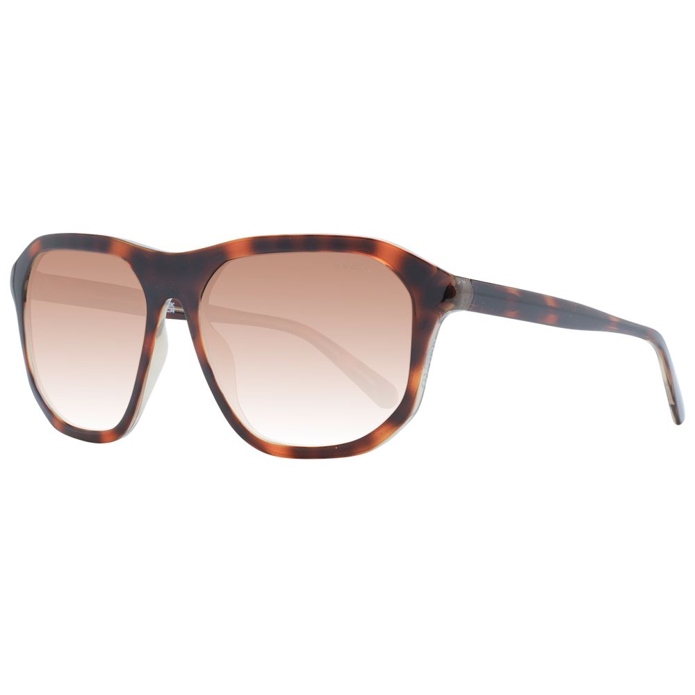 This Sunglasses by Guess for unisex in plastic brown presents a sumptuous silhouette, showcasing a sumptuous full-rim square frame design in brown coloured frame and high-performance gradient category-2-medium-tint lens.