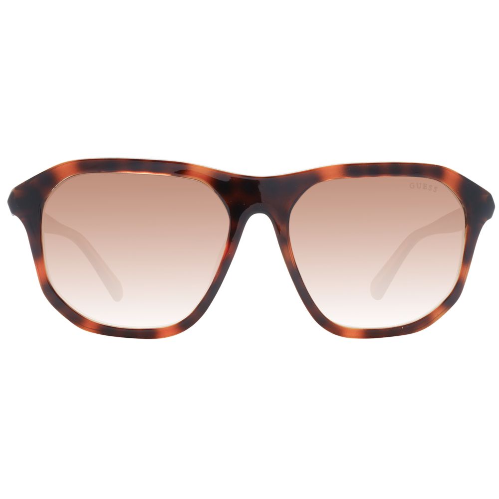 Sunglasses by Guess for unisex in plastic brown features a sumptuous silhouette, showcasing a sumptuous full-rim square frame design in brown coloured frame with high-performance gradient category-2-medium-tint lens.