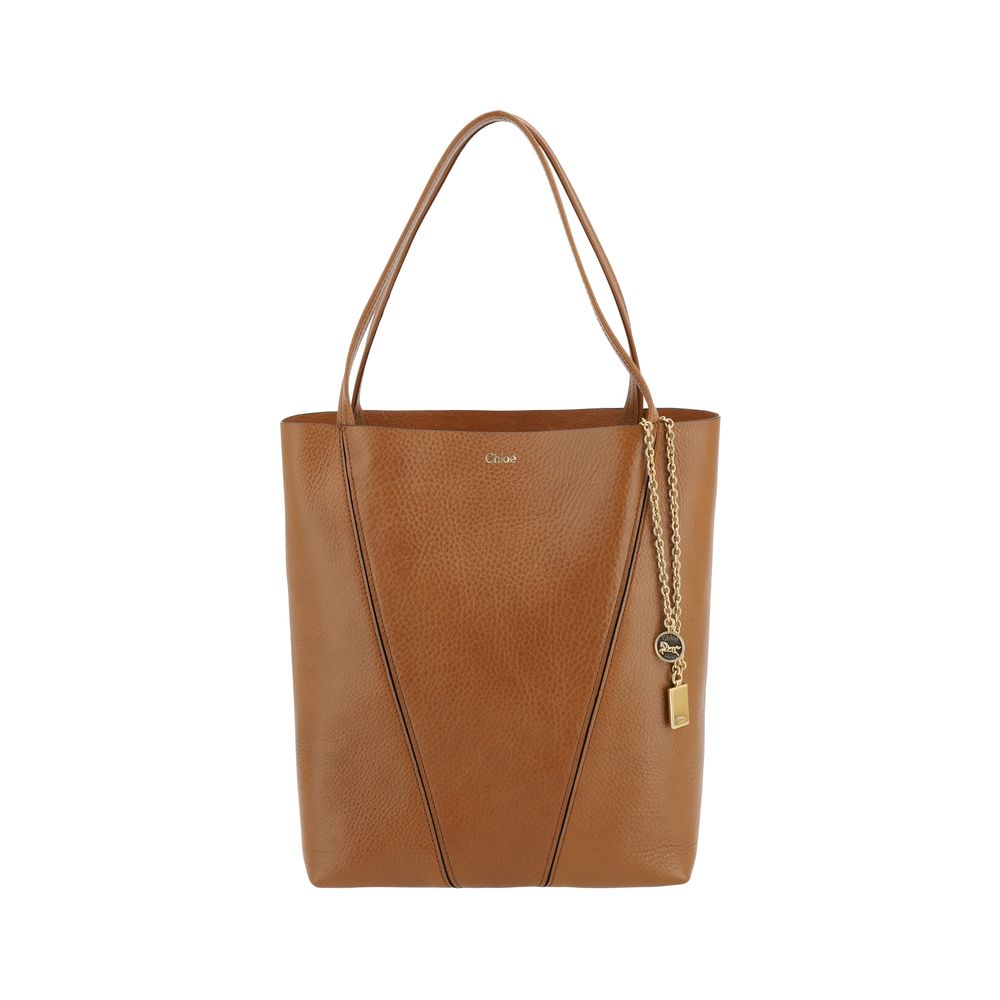 Shoulder Bag by Chloé for women in bos taurus calf grained leather brown & monogram presents a versatile silhouette, showcasing a secure and versatile single-compartment with versatile shoulder-strap & handle for a sophisticated look.