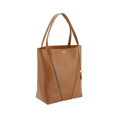 Shoulder Bag by Chloé for women in bos taurus calf grained leather brown & monogram features a enviable silhouette, showcasing a secure , ample single-compartment, and enviable shoulder-strap & handle for a enviable finish.