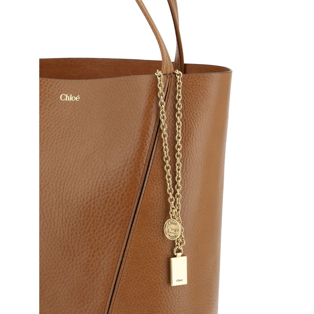 Shoulder Bag by Chloé for women in bos taurus calf grained leather brown & monogram features an effortlessly chic silhouette with a secure , ample single-compartment, and versatile shoulder-strap & handle for effortlessly chic everyday luxury.