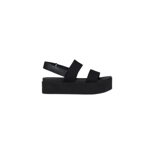 Sandals by Calvin Klein Jeans for women in organic cotton black presents a sculptural silhouette, showcasing the Women's Organic Cotton Sandals design with a sculptural and for a premium look.