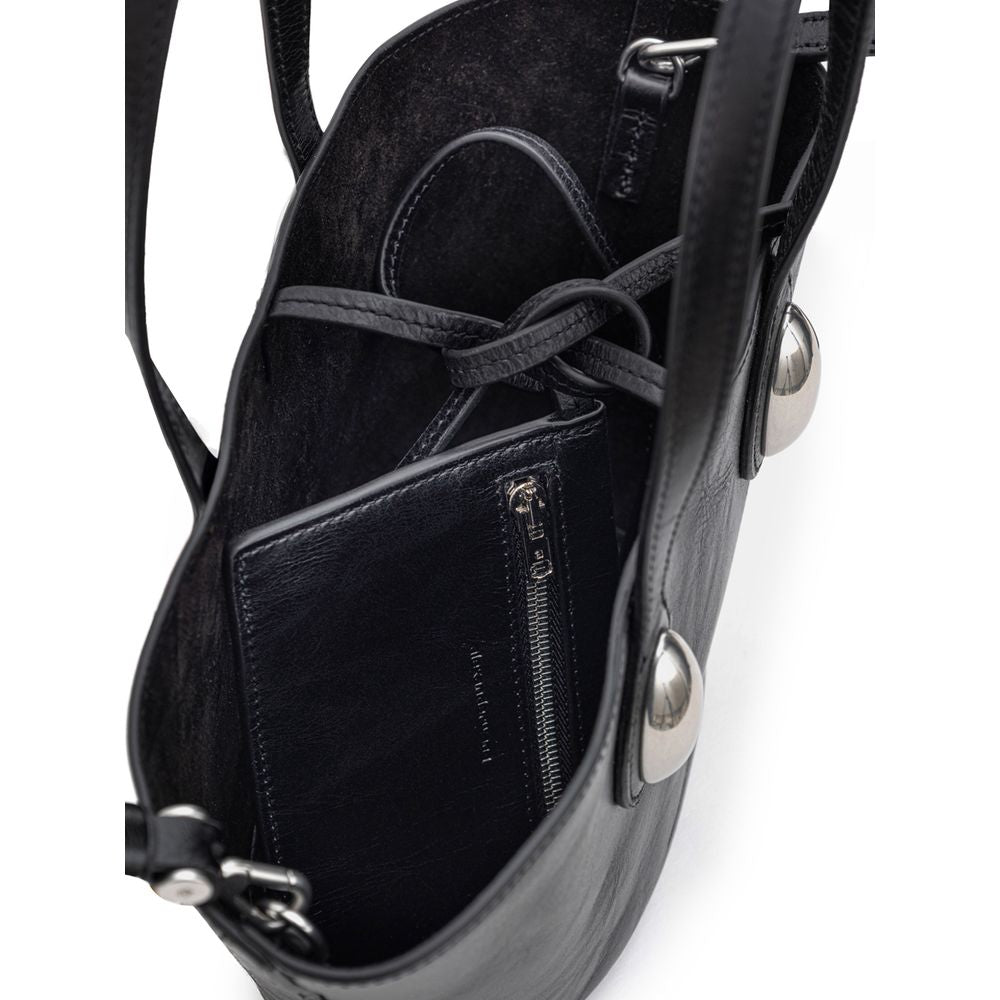 Mini Shoulder Dome Bag by Alexander Wang for women in leather & metal black presents a statuesque silhouette, showcasing a secure and statuesque single-compartment with versatile shoulder-strap, adjustable-strap & handle for a sophisticated look.