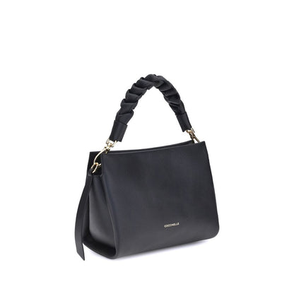 Crossbody Handbag by Coccinelle for women in bos taurus calf leather black & monogram features a refined silhouette, showcasing a secure zipper, organized , and versatile crossbody-strap, shoulder-strap, handle & adjustable-strap for a refined finish.