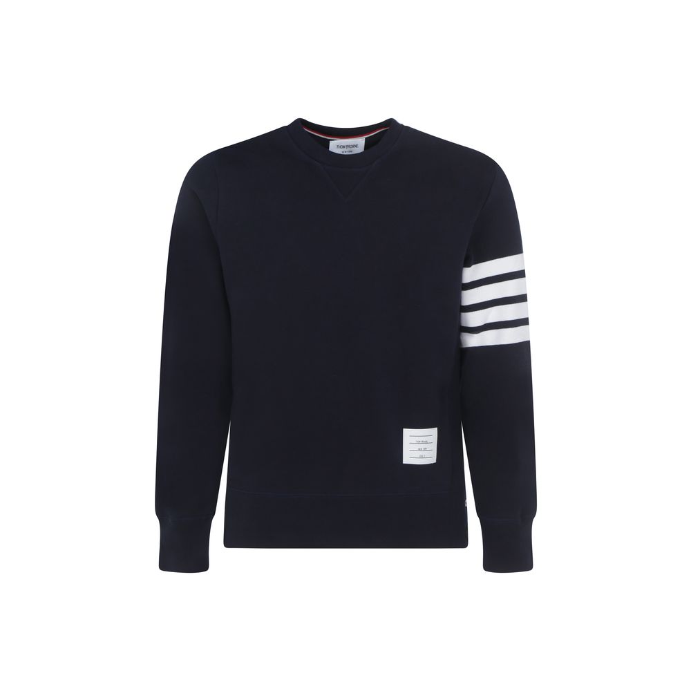 Sweatshirt by Thom Browne for men in cotton blue, white, monogram & striped features an provocated silhouette, detailed with a provocated long-sleeve and a refined crew neckline for a sophisticated aesthetic.
