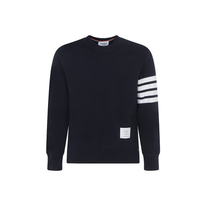 Sweatshirt by Thom Browne for men in cotton blue, white, monogram & striped features an provocated silhouette, detailed with a provocated long-sleeve and a refined crew neckline for a sophisticated aesthetic.