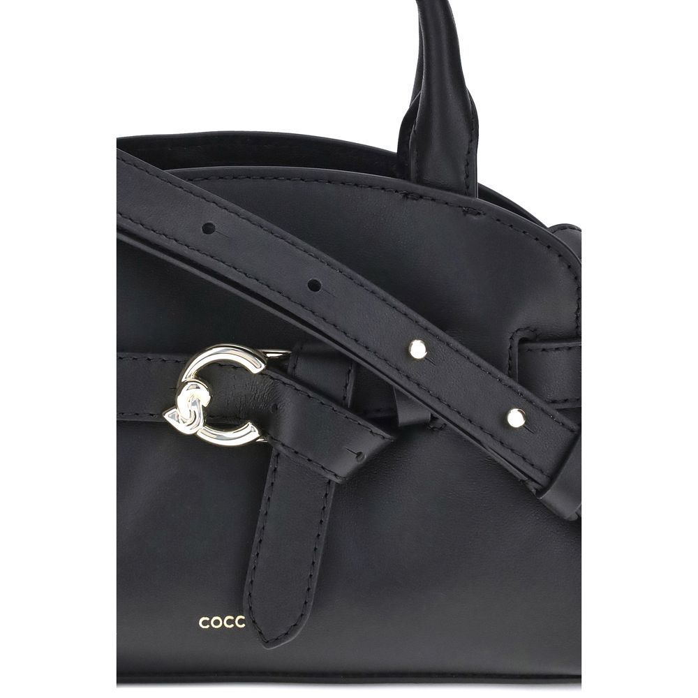 Crossbody Handbag by Coccinelle for women in bos taurus calf leather black & gold features a ornamental silhouette, showcasing a secure magnetic, ample built-in-compartments, and ornamental crossbody-strap, shoulder-strap, adjustable-strap & handle for a sophisticated look.