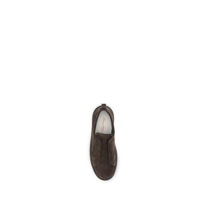 Sneakers by Santoni for men in bos taurus calf suede leather brown presents a sumptuous silhouette, artfully capturing the essence of the Men's Low Top Slip On Bos Taurus Calf Suede Leather Sneakers with its sumptuous low-top slip-on style design.