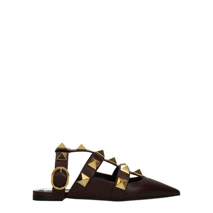 Flat Sandals by Valentino Garavani for women in leather brown & gold showcases a sculptural silhouette as Women's Leather Flat Sandals, defined by a sculptural flat and sculptural for a sculptural look.