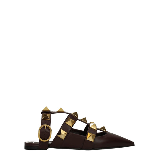 Flat Sandals by Valentino Garavani for women in leather brown & gold showcases a sculptural silhouette as Women's Leather Flat Sandals, defined by a sculptural flat and sculptural for a sculptural look.