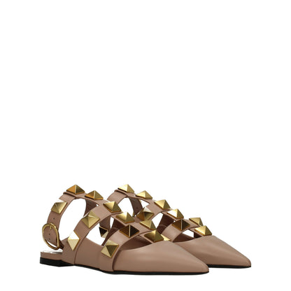 Flat Sandals by Valentino Garavani for women in leather gold, pink & rose presents a sculptural silhouette, showcasing the Women's Leather Flat Sandals design with a sculptural flat and for a premium look.