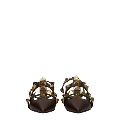 Flat Sandals by Valentino Garavani for women in leather brown & gold features an effortlessly chic silhouette from the Women's Leather Flat Sandals collection, showcasing a effortlessly chic flat and elegant .