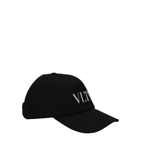 Hat by Valentino Garavani for men in stretch cotton black showcases a delicate silhouette, artfully capturing the essence of the delicate Stretch Cotton Hat design for a sophisticated look.
