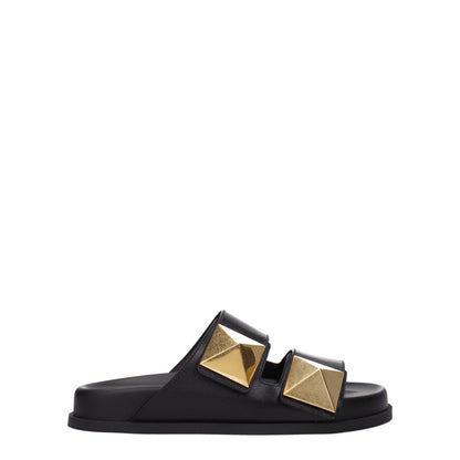 Flat Clogs Sandals by Valentino Garavani for women in leather & rubber black features an architectural design from the Women's Leather & Rubber Flat Clogs Sandals collection, defined by a architectural flat and open toe style for a architectural finish.