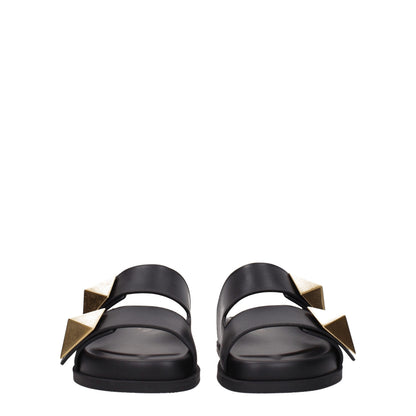 Flat Clogs Sandals by Valentino Garavani for women in leather & rubber black features an architectural design from the Women's Leather & Rubber Flat Clogs Sandals collection, defined by a architectural flat and open toe style for a architectural finish.