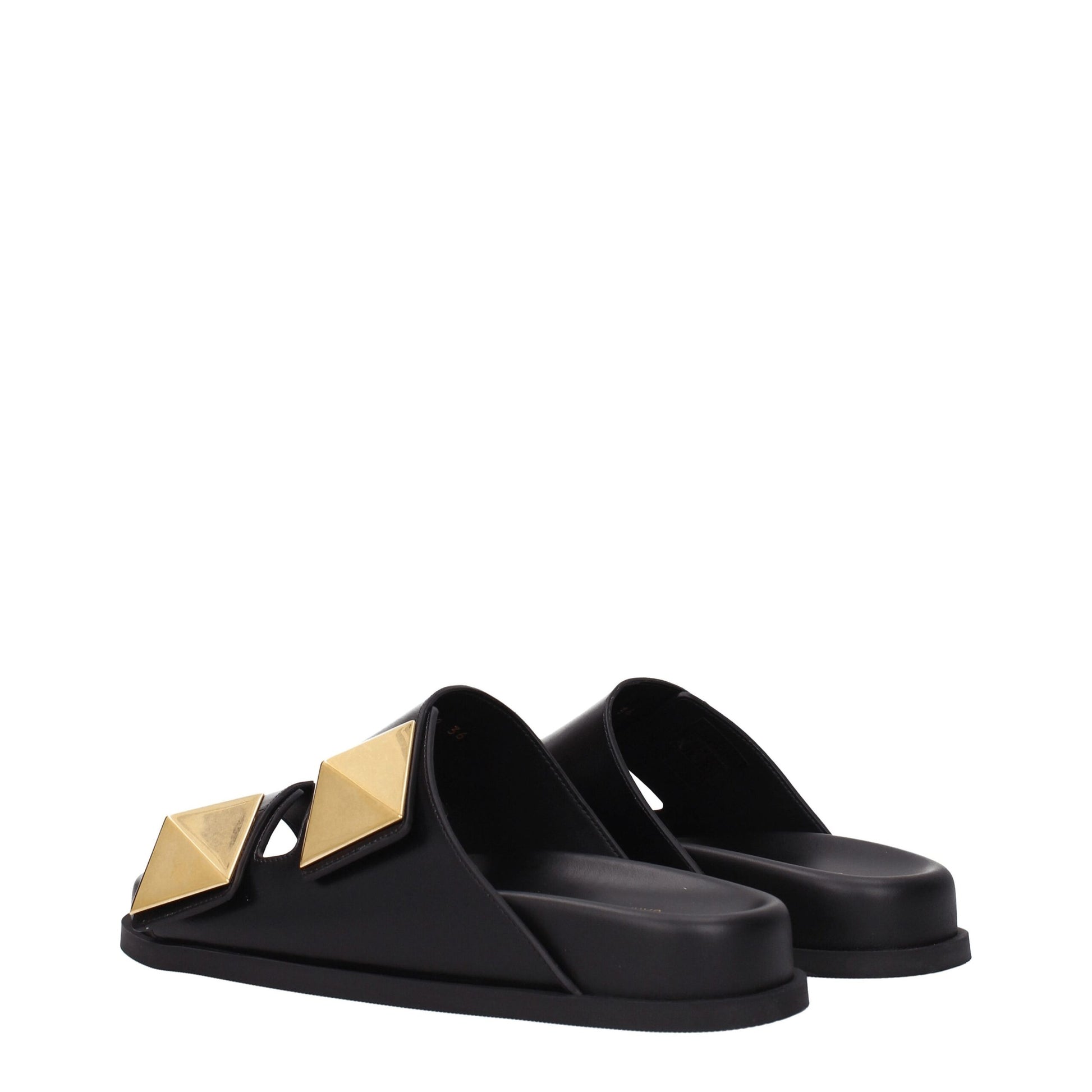 Flat Clogs Sandals by Valentino Garavani for women in leather & rubber black features an exquisite silhouette, showcasing the exquisite Women's Leather & Rubber Flat Clogs Sandals with a flat and open toe style.