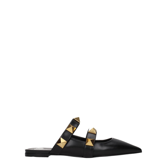 Mules Sandals Flat Shoes by Valentino Garavani for women in leather black & gold showcases a dynamic silhouette, artfully capturing Women's Leather Mules Sandals Flat Shoes through its distinctive and elegant .