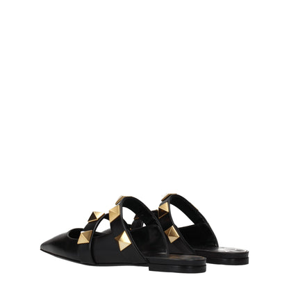 Mules Sandals Flat Shoes by Valentino Garavani for women in leather black & gold presents a impeccable silhouette as Women's Leather Mules Sandals Flat Shoes, artfully designed with a and a impeccable for a refined, upscale finish.