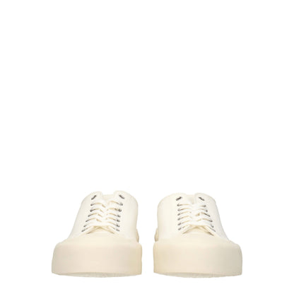 Sneakers by Jil Sander for men in rubber & fabric beige & ivory presents a sumptuous silhouette, artfully capturing the essence of the Men's Low Top Rubber & Fabric Sneakers with its sumptuous low-top style design.