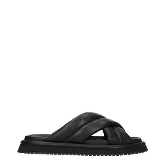 Flat Clogs Slippers by Dolce & Gabbana for men in leather & rubber black features an effortlessly elegant silhouette, showcasing the Men's Leather & Rubber Flat Clogs Slippers design with an effortlessly elegant flat and a open toe style for a effortlessly elegant look.