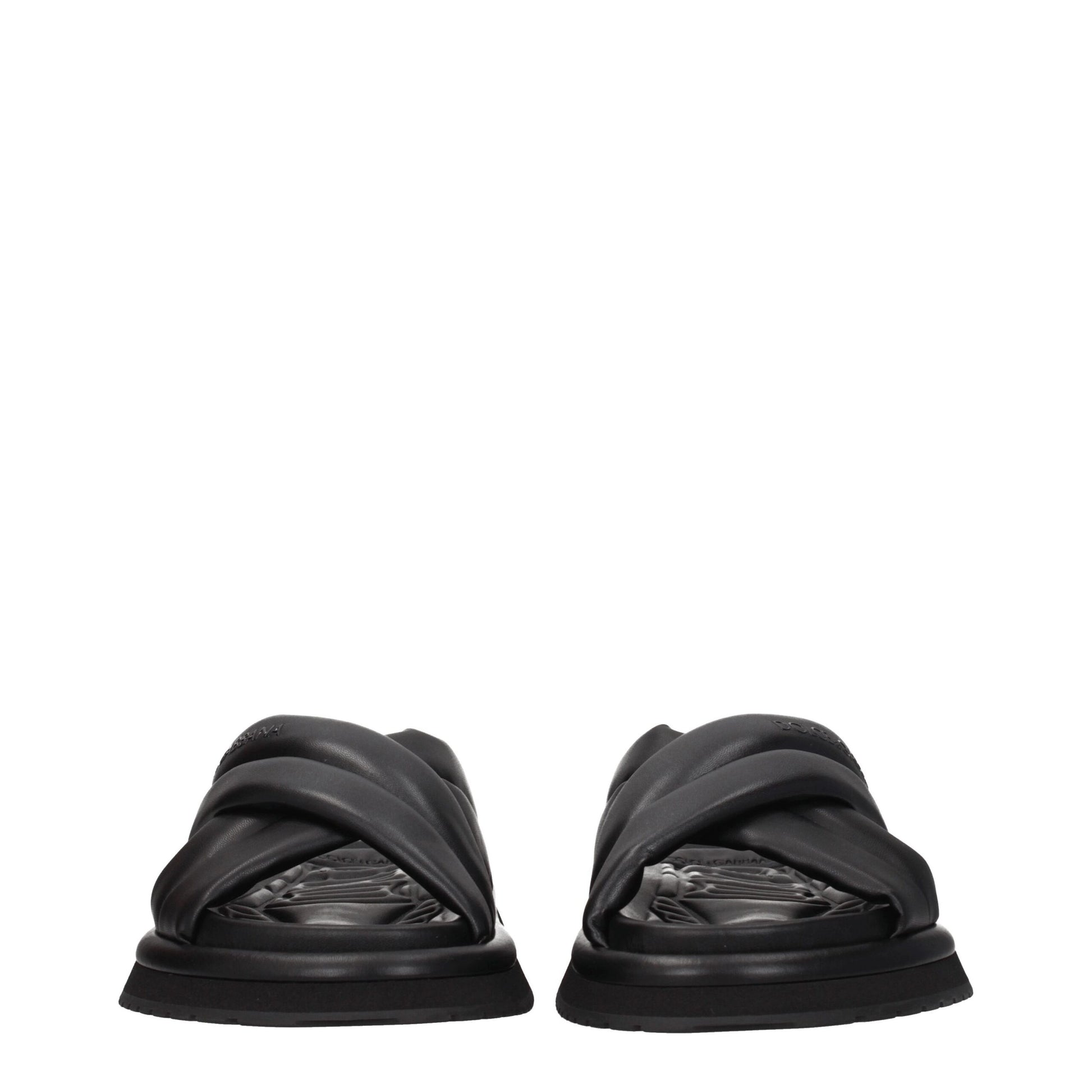 Flat Clogs Slippers by Dolce & Gabbana for men in leather & rubber black presents a effortless silhouette, showcasing the elegant Men's Leather & Rubber Flat Clogs Slippers design with its unique flat and sophisticated open toe style.