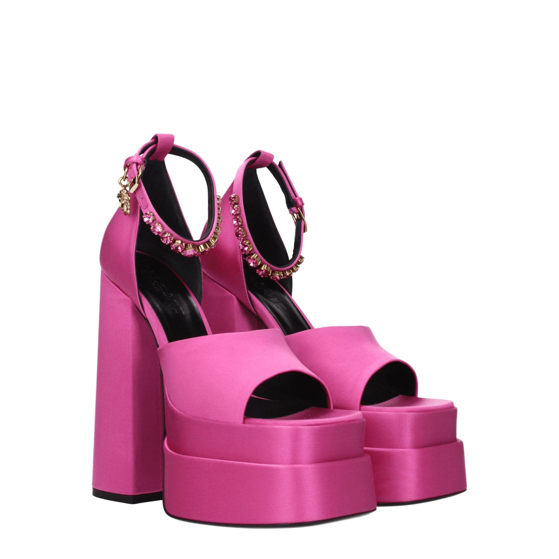 High-Heel Sandals by Versace for women in leather & satin fuchsia & pink showcases a sculptural silhouette as Women's Leather & Satin High-Heel Sandals, defined by a sculptural high-heel and sculptural open toe style for a sculptural look.