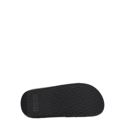 Flat Clogs Sandals by Versace for women in black & gold features an architectural design from the Women's Leather & Rubber Flat Clogs Sandals collection, defined by a architectural flat and open toe style for a architectural finish.