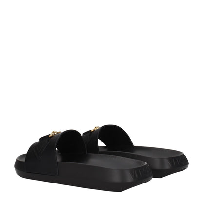 Flat Clogs Sandals by Versace for men in leather & rubber black & gold features an architectural design from the Men's Leather & Rubber Flat Clogs Sandals collection, defined by a architectural flat and open toe style for a architectural finish.