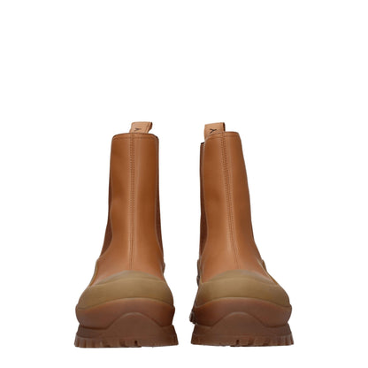 Mid-Heel Ankle Boots by Stella McCartney for women in leather & rubber brown features an dynamic silhouette, showcasing the dynamic Women's Leather & Rubber Mid-Heel Ankle Boots design with its distinctive 5-5-cm-heel mid-heel and elegant round toe style.