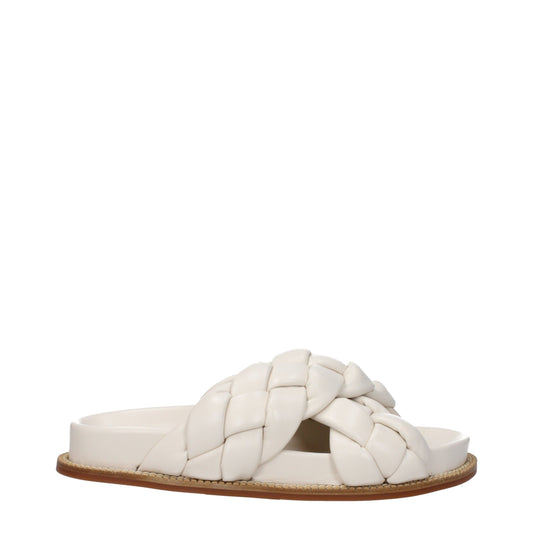 Flat Clogs Sandals by Fabiana Filippi for women in leather & rubber and beige & ivory presents a captivating silhouette, showcasing the signature style of the Women's Leather & Rubber Flat Clogs Sandals with a captivating flat and captivating open toe style.