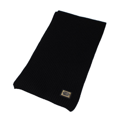 Scarf by Dolce & Gabbana for men in cashmere black showcases a warm silhouette from the Cashmere Scarf collection, offering a warm drape that exudes sophisticated luxury.