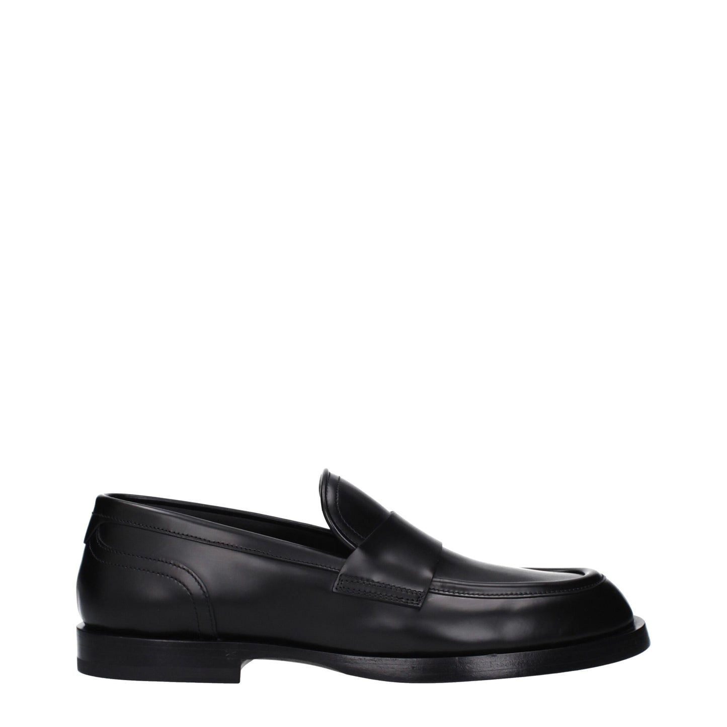 Flat Loafer Shoes by Dolce & Gabbana for men in leather black features an effortless chic silhouette, showcasing the Men's Leather Flat Loafer Shoes design with an effortless chic flat and a round toe style for a effortless chic look.