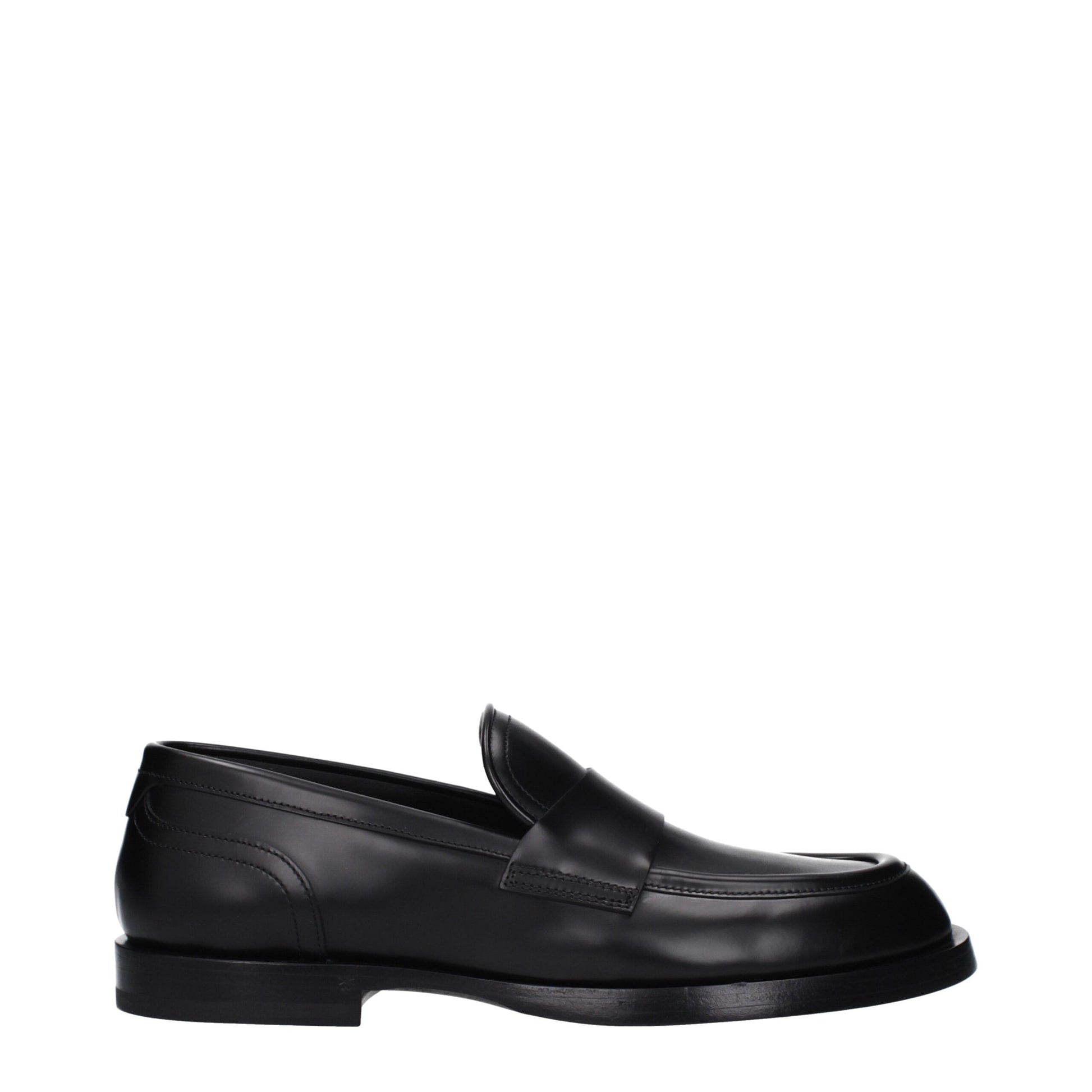 Flat Loafer Shoes by Dolce & Gabbana for men in leather black features an effortless chic silhouette, showcasing the Men's Leather Flat Loafer Shoes design with an effortless chic flat and a round toe style for a effortless chic look.