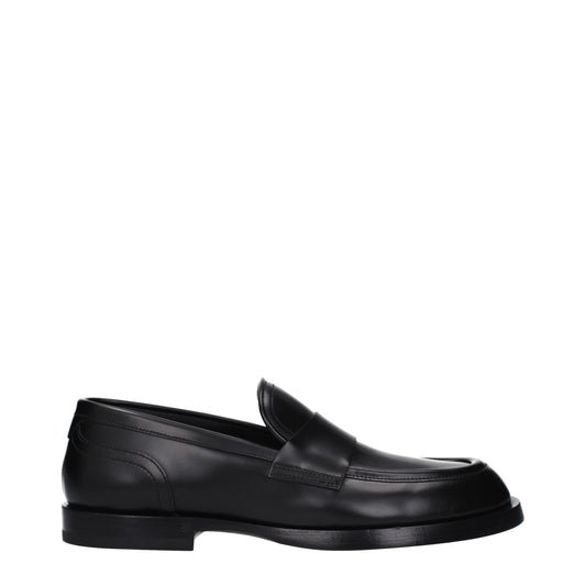 Flat Loafer Shoes by Dolce & Gabbana for men in leather black features an effortless chic silhouette, showcasing the Men's Leather Flat Loafer Shoes design with an effortless chic flat and a round toe style for a effortless chic look.