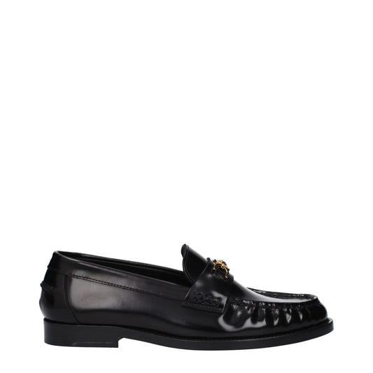Flat Loafer Slip-On Shoes by Versace for women in leather black showcases a timeless silhouette from the Women's Leather Flat Loafer Slip-On Shoes collection, featuring a timeless flat and round toe style for a timeless finish.