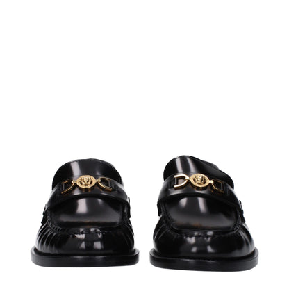 Flat Loafer Slip-On Shoes by Versace for women in leather black features an ergonomic silhouette, perfectly showcasing Women's Leather Flat Loafer Slip-On Shoes with its distinct flat and elegant round toe style.