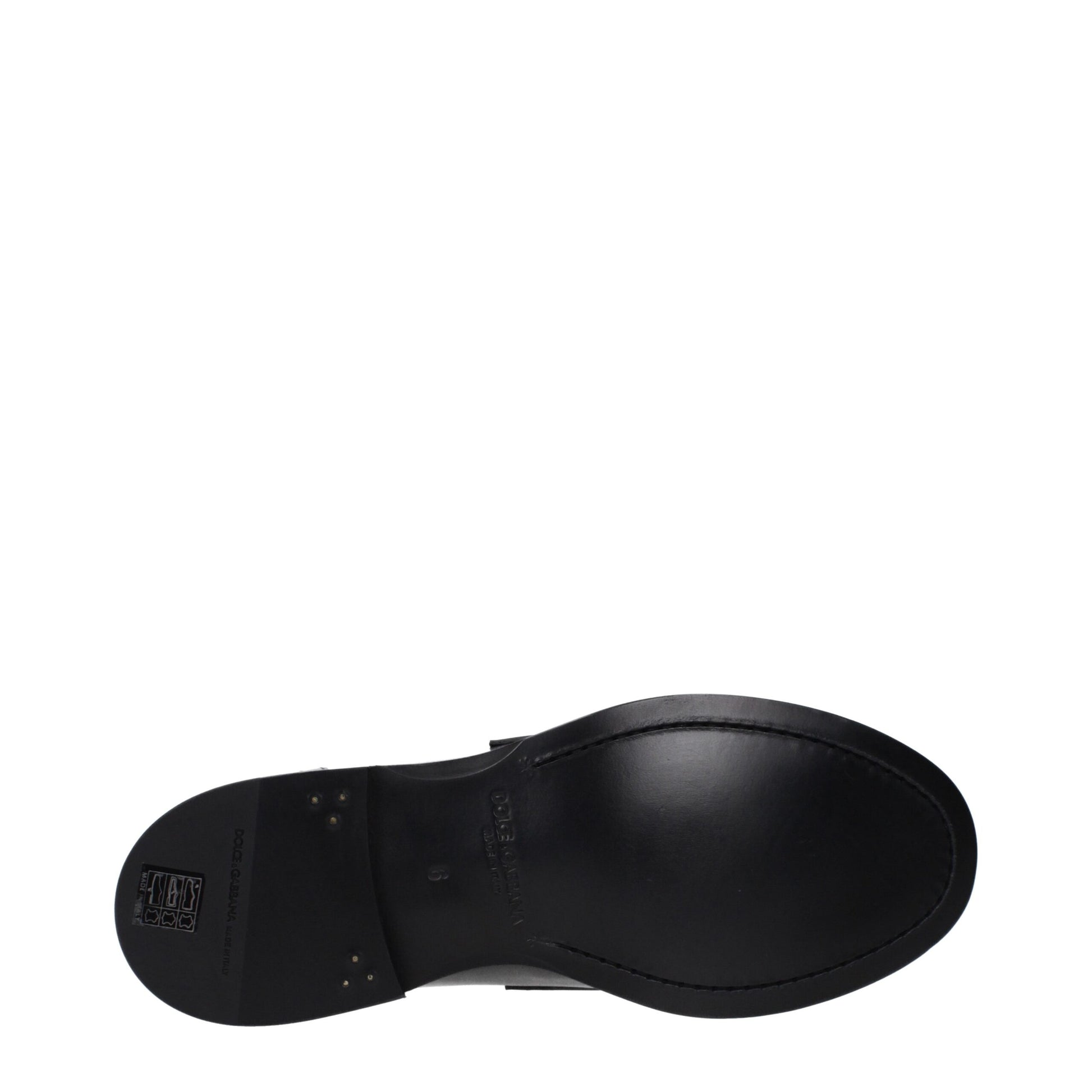 Flat Loafer Shoes by Dolce & Gabbana for men in leather black features an effortless chic silhouette, showcasing the Men's Leather Flat Loafer Shoes design with an effortless chic flat and a round toe style for a effortless chic look.