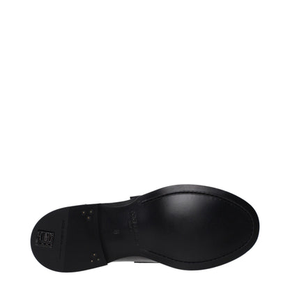 Flat Loafer Shoes by Dolce & Gabbana for men in leather black features an effortless chic silhouette, showcasing the Men's Leather Flat Loafer Shoes design with an effortless chic flat and a round toe style for a effortless chic look.