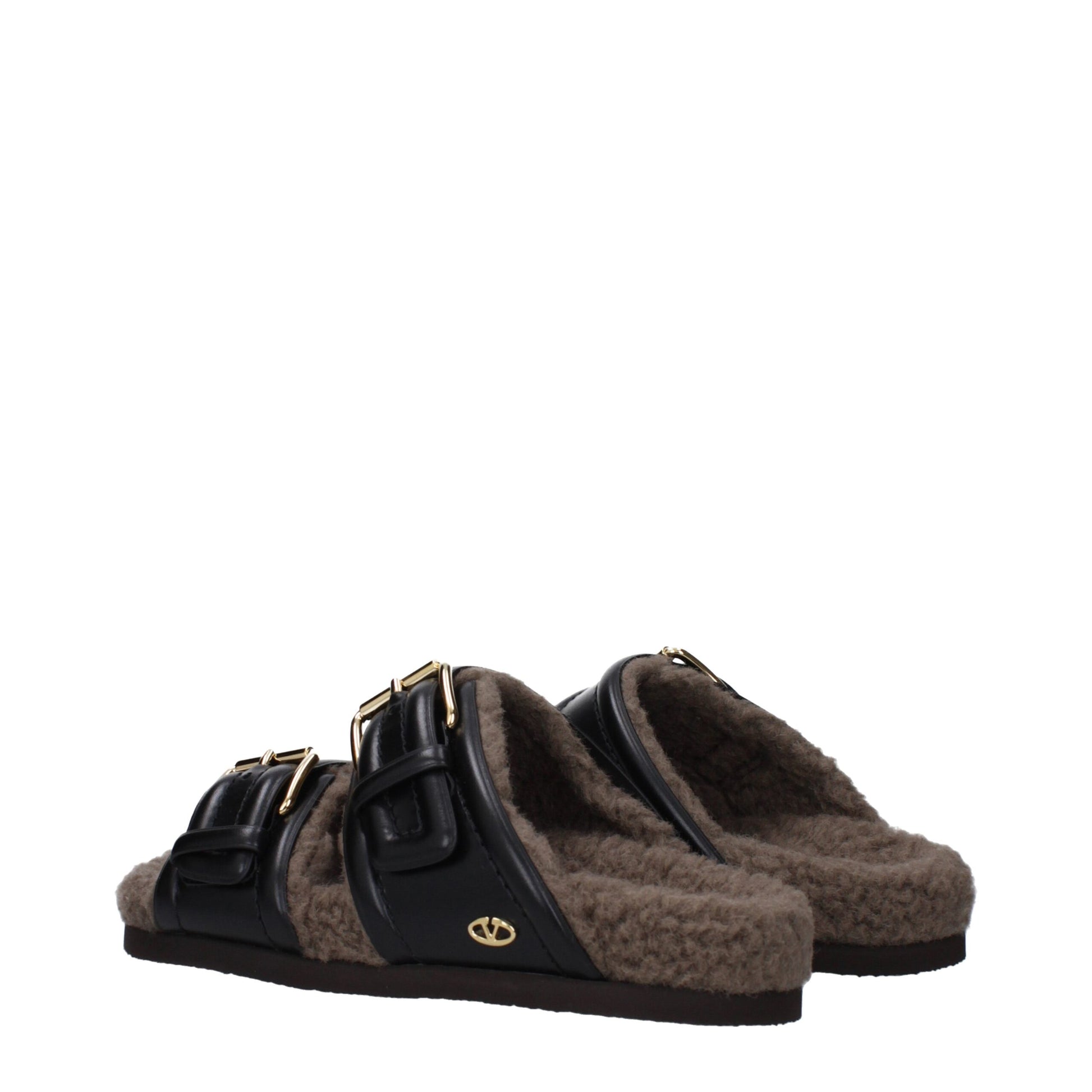 Flat Clogs Slippers by Valentino Garavani for women in leather & rubber and black presents a sculptural silhouette as Women's Leather & Rubber Flat Clogs Slippers, featuring a sculptural flat and a sculptural open toe style for refined comfort.