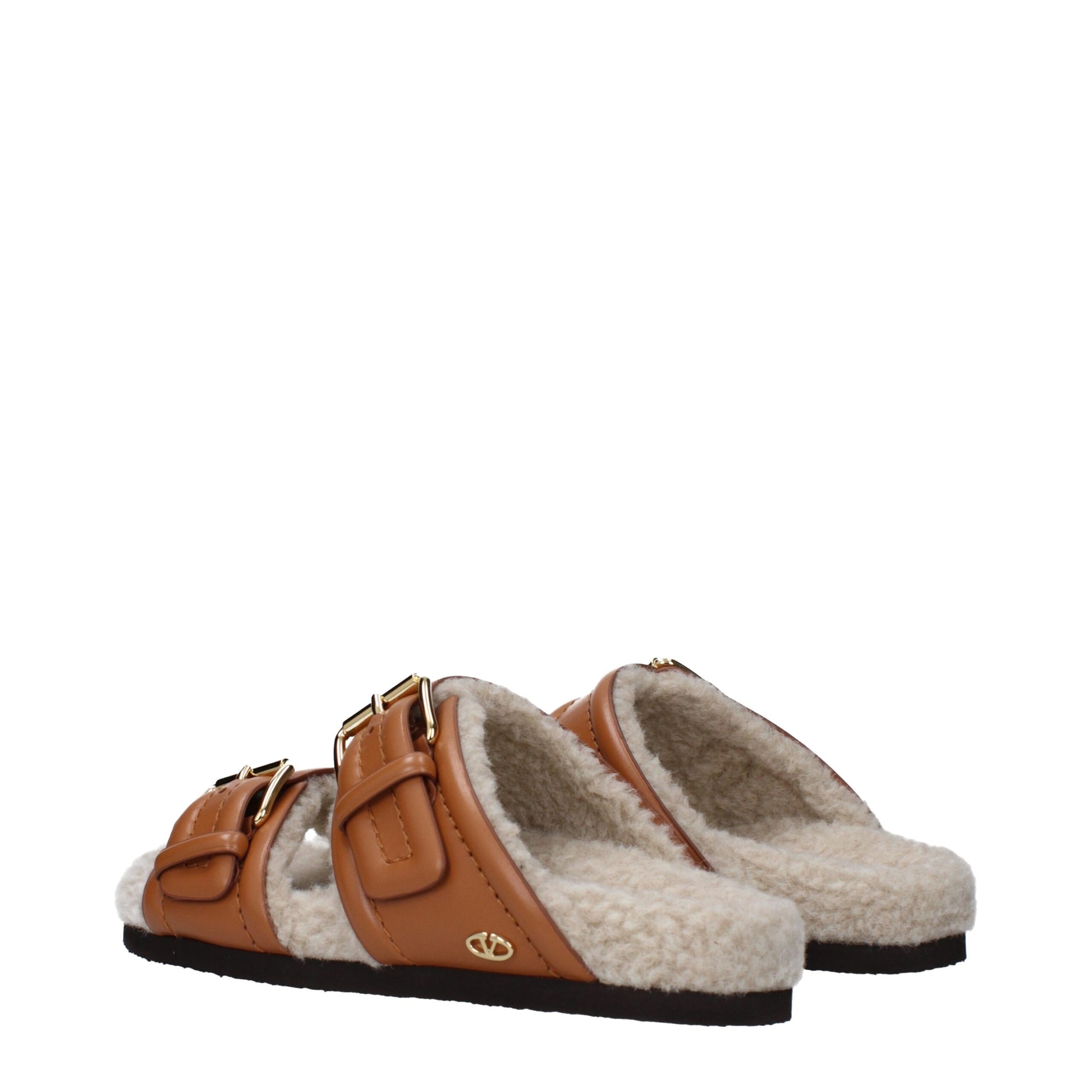 Flat Clogs Sandals by Valentino Garavani for women in leather & rubber brown features an architectural design from the Women's Leather & Rubber Flat Clogs Sandals collection, defined by a architectural flat and almond open toe style for a architectural finish.