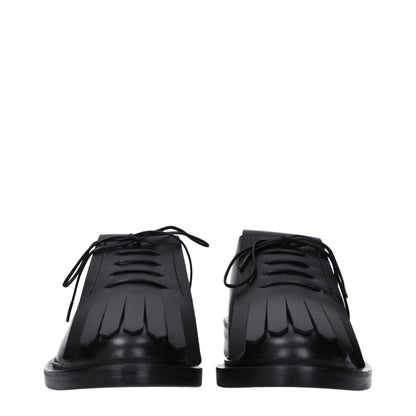 Flat Lace-Up Shoes by Max Mara for unisex in leather & rubber black showcases a timeless silhouette from the Unisex Leather & Rubber Flat Lace-Up Shoes collection, featuring a timeless flat and round toe style for a timeless finish.