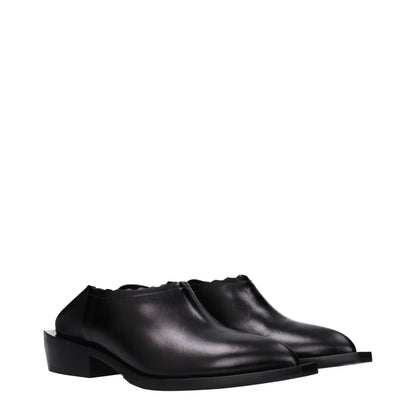 Mules Loafers Flat Shoes by Moschino for women in leather & rubber black showcases a enchanting silhouette as part of the Women's Leather & Rubber Mules Loafers Flat Shoes collection, defined by a enchanting and for a enchanting look.