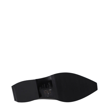 Mules Loafers Flat Shoes by Moschino for women in leather & rubber black showcases a enchanting silhouette as part of the Women's Leather & Rubber Mules Loafers Flat Shoes collection, defined by a enchanting and for a enchanting look.